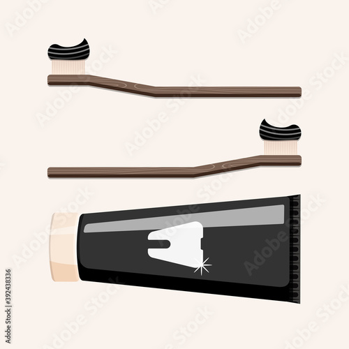 Wooden, bamboo toothbrushes with black toothpaste isolated on beige background. Eco friendly concept in flat style.