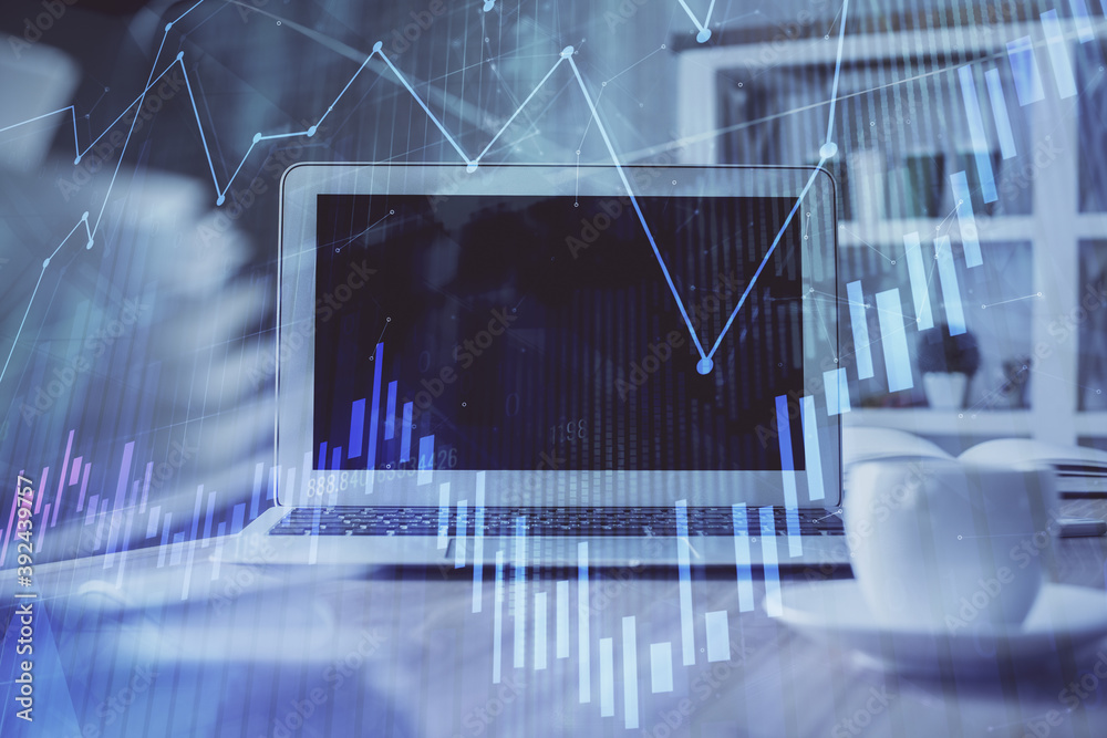 Forex market chart hologram and personal computer background. Multi exposure. Concept of investment. Forex market chart hologram and personal computer background. Multi exposure. Concept of investment.