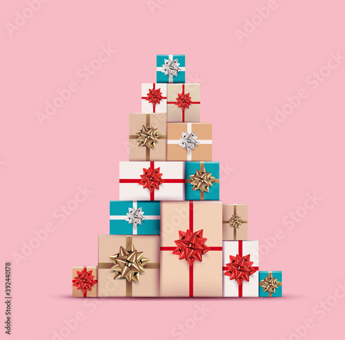 Christmas gifts or present colored boxes laid out in christmas tree shape isolated on pink background. Realistic vector illustration for christmas banner or flyer design.