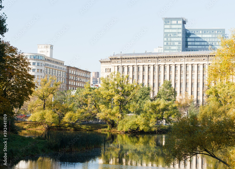 moscow, Russia, Oct 1, 2020:  Sunny day at Lefortovo park. Pond. Bauman technical university building in background