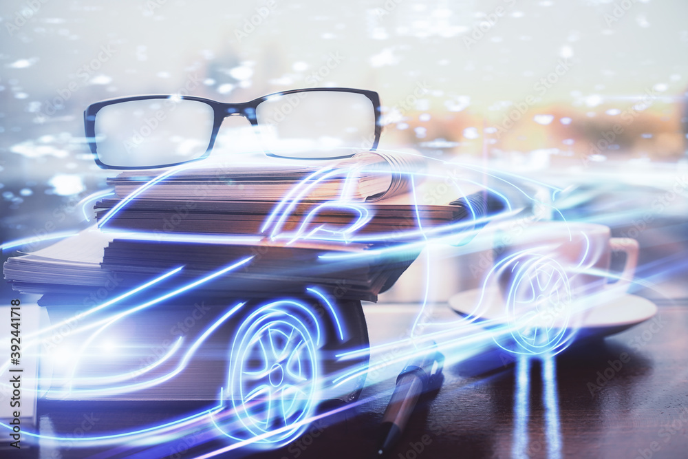 Obraz premium Automobile theme hologram with glasses on the table background. Autopilot concept. Double exposure.