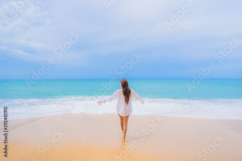 Portrait beautiful young asian woman relax leisure smile around beach sea ocean