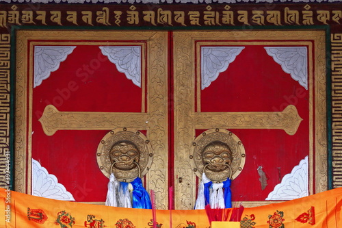 Closed red wooden door-Badain Jaran Temple. Sumu Jaran lake-Inner Mongolia-China-1113 photo