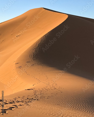 Huge desert dune at Erg Chigaga  at the gates of the Sahara. Morocco. Concept of travel and adventure.