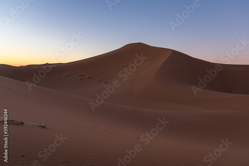 Huge desert dunes of Erg Chigaga  at the gates of the Sahara  al amanecer. Morocco. Concept of travel and adventure.