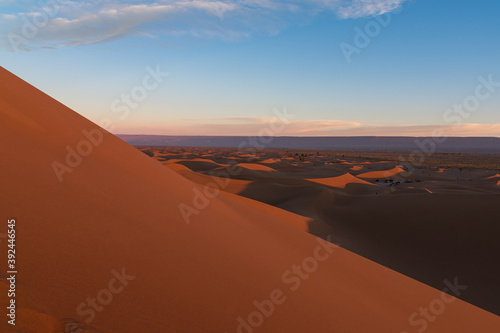 Huge desert dunes of Erg Chigaga  at the gates of the Sahara  al amanecer. Morocco. Concept of travel and adventure.