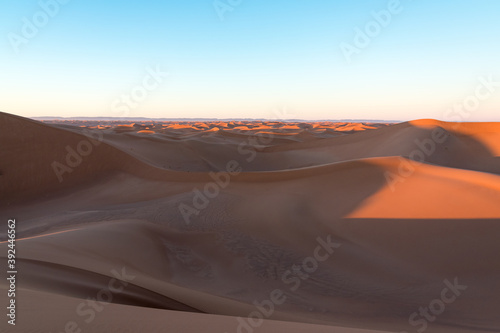 Huge desert dunes of Erg Chigaga, at the gates of the Sahara, al amanecer. Morocco. Concept of travel and adventure.