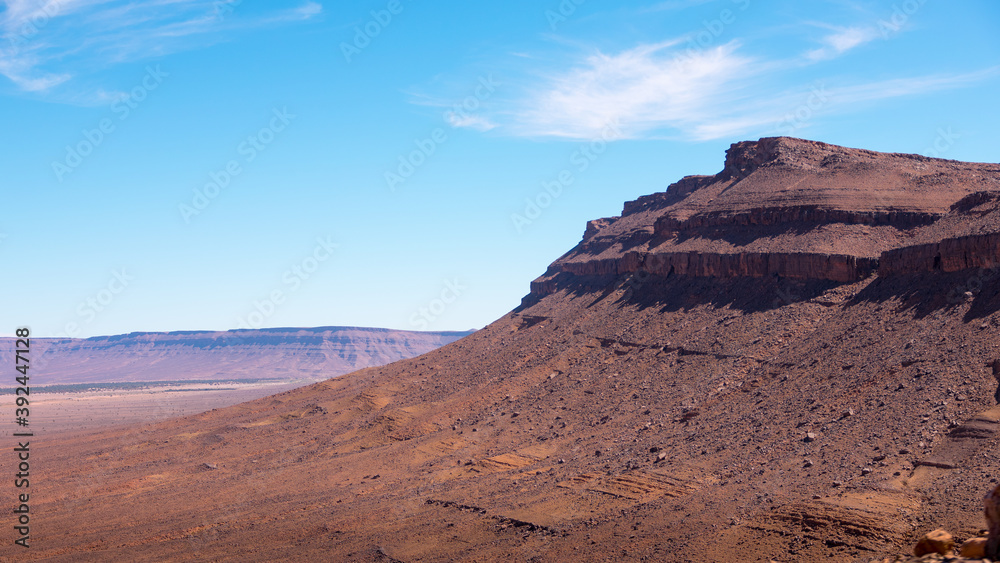 Wide angle shot of rock formations during the day in Draa Valley, Morocco