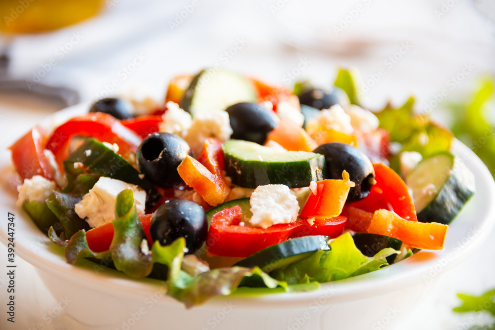 Greek salad with vegetables and feta cheese, healthy vegetable meal Greek salad with vegetables and feta cheese, healthy vegetable meal