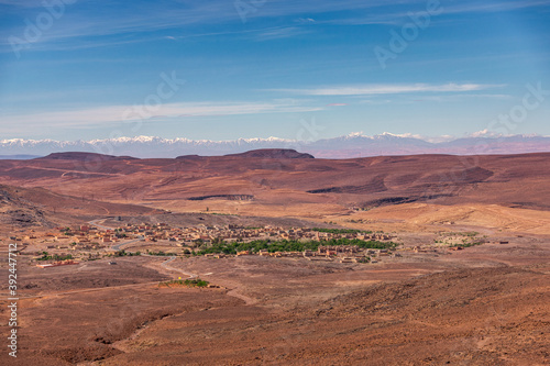 Daytime wide angle shoot of a town and the Atlas Mountains in the background, Morocco.