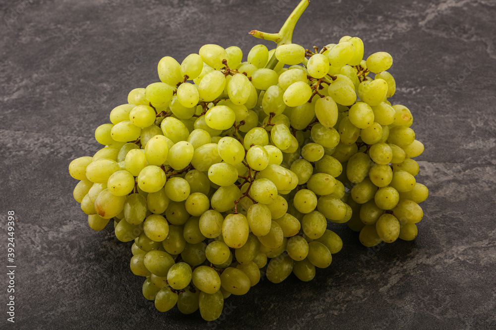 Green grape branch over background Green grape branch over background