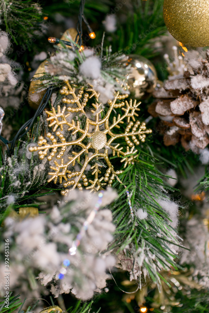 Christmas decorations. Decorative golden snowflake on the Christmas tree Christmas decorations. Decorative golden snowflake on the Christmas tree