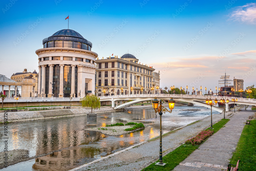 Beautiful sunset in Skopje with light reflection on Vardar river at sunset.