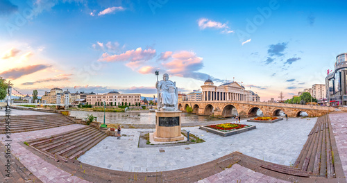 SKOPJE, NORTH MACEDONIA, 01.08.2020: Skopje City Center at sunset - panoramic view. Architecture and buildings of Skopje. Archaeological Museum, Stone Bridge, Monument of Justinian.