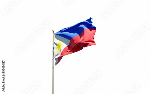 National state flag of Philippines fluttering at sky background.