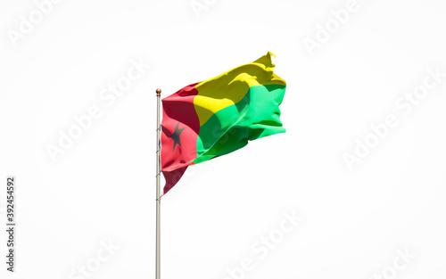 Beautiful national state flag of Guinea-Bissau on white background. Isolated close-up Guinea-Bissau flag 3D artwork.