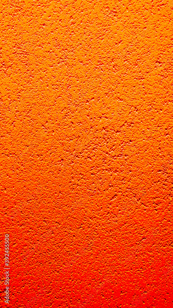 Fototapeta premium Orange vertical cement background, slightly blurred