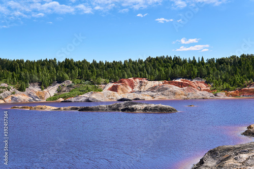 island where gulls nest in the middle of a lake in an old kaolin quarry