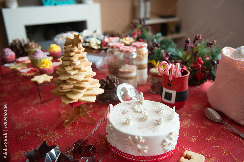 
table set in a home with typical Christmas products and sweets