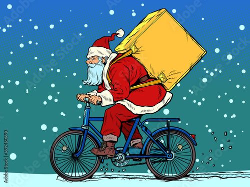 Christmas delivery of gifts and purchases. Santa Claus courier on a Bicycle