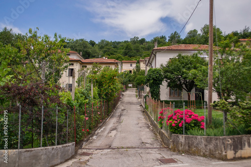 street with beautiful houses and courtyards in Italy