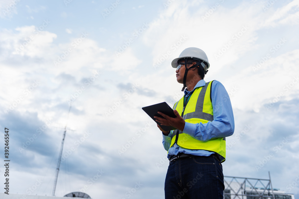 Engineering Consulting People on construction site holding tablet in his hand. Management in business workflow and Building inspector with technology in Big Project. Engineering Consulting People on construction site holding tablet in his hand. Management in business workflow and Building inspector with technology in Big Project.