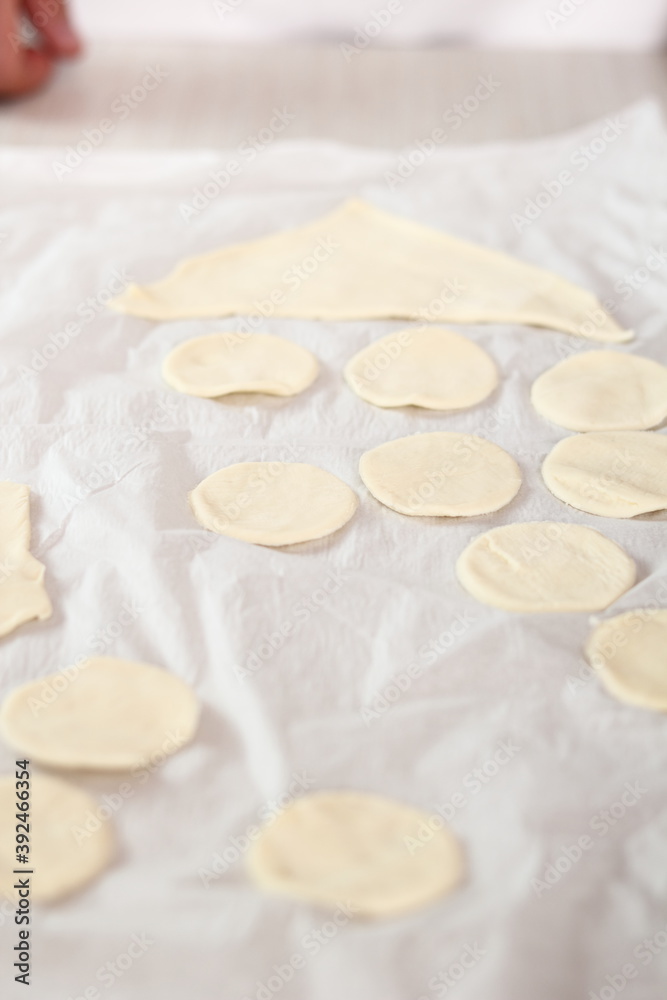Cutting Puff Pastry into rounds. Making Salmon in Puff Pastry Series. Cutting Puff Pastry into rounds. Making Salmon in Puff Pastry Series.