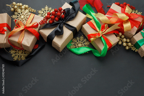 Set of gift boxes, christmas decorations on dark background, stylish luxury happy new 2021 year concept, xmas holiday present, sale, coupon idea, greeting card, dark theme