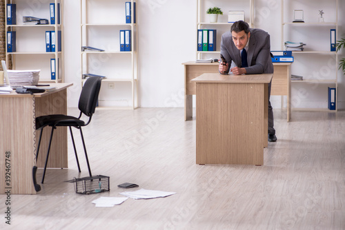 Young male employee and mousetrap in the office © Elnur