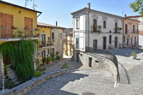 Fototapeta Naklejka Na Ścianę i Meble -  A narrow street among the old houses of Pietrelcina, a medieval village in the Campania region, Italy.