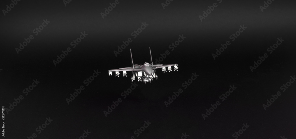 silver plane fighter isolated on black background