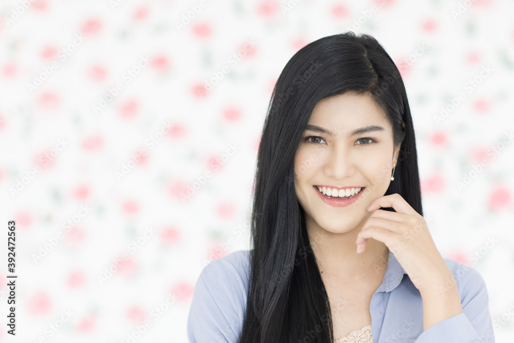 Cute and beautiful young black long hair Asian woman standing and smiling look at the camera with a self-confident and friendly pose Cute and beautiful young black long hair Asian woman standing and smiling look at the camera with a self-confident and friendly pose