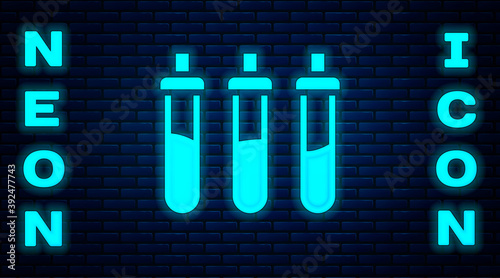 Glowing neon Reagent bottle for physics and chemistry icon isolated on brick wall background. Vector.
