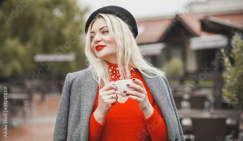 Woman at European cafe, plus size blonde nice woman . Pretty nice girl in restaurant at terrace with a cup of coffee, lifestyle ladies, tourist at Europe  photo