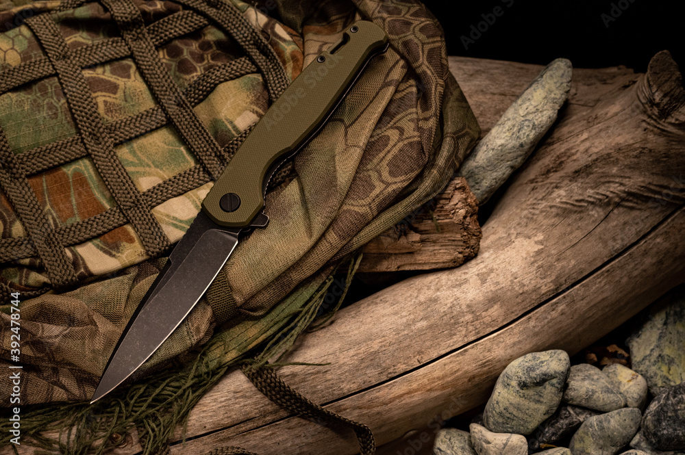 Military composition with knife and shape. Camouflage knife. Military composition with knife and shape. Camouflage knife.