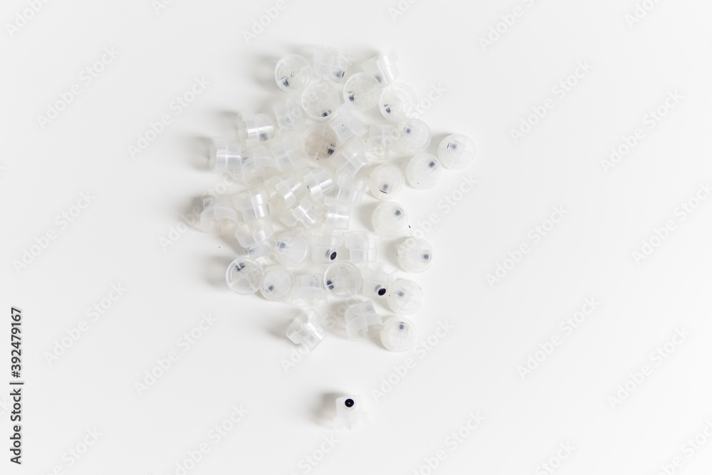 transparent caps on a white background close-up focus on one cap transparent caps on a white background close-up focus on one cap