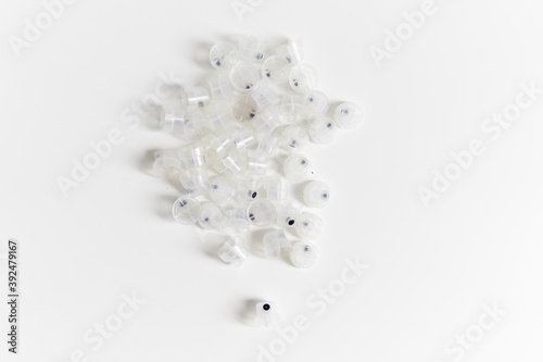transparent caps on a white background close-up focus on one cap