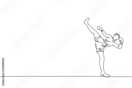 Single continuous line drawing of young sportive man kickboxer exercise high kick in sport hall. Fight competition kickboxing sport concept. Trendy one line draw graphic design vector illustration