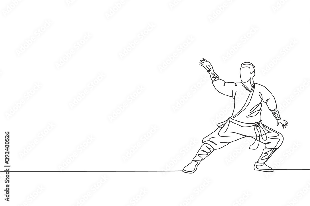 Single continuous line drawing young muscular shaolin monk man train martial art at shaolin temple. Traditional Chinese kung fu fight concept. Trendy one line draw design graphic vector illustration