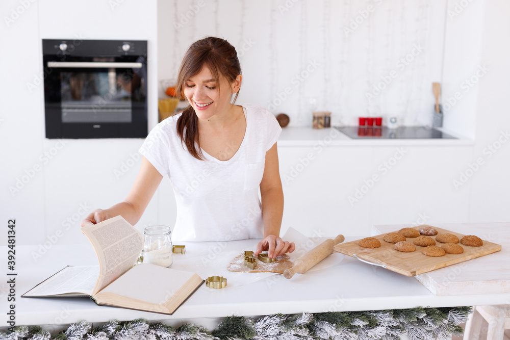 Woman cooks cookies for Christmas