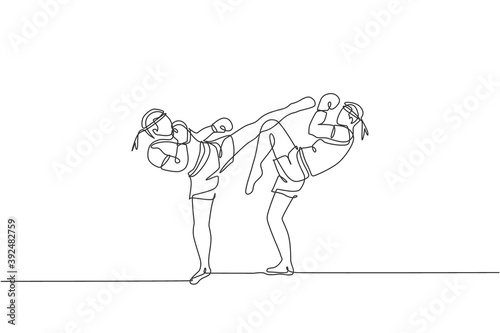 Single continuous line drawing of two young sportive men training thai boxing at gym club center. Combative muay thai sport concept. Competition event. Trendy one line draw design vector illustration