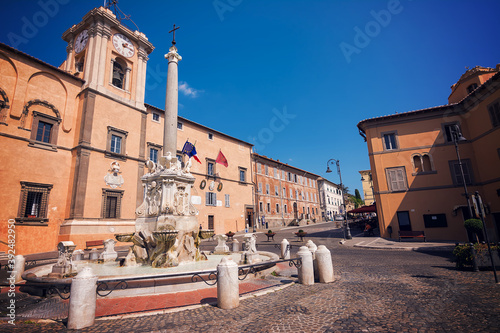 Fototapeta Naklejka Na Ścianę i Meble -  Fountain and town hall in the square of Tarquinia (Italy)