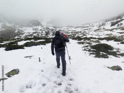 men climbing in the snow