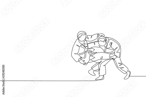 Single continuous line drawing of two young sportive judoka fighter men practice judo skill at dojo gym center. Fighting jujitsu, aikido sport concept. Trendy one line draw design vector illustration