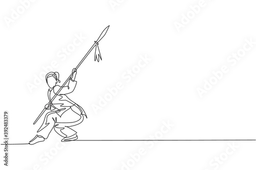 Single continuous line drawing of young woman wushu fighter, kung fu master in uniform training with spear at dojo center. Fighting contest concept. Trendy one line draw design vector illustration