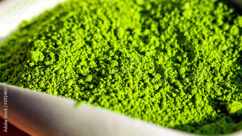 Japanese bright green powder tea, macro picture with blurred foreground and background.  photo