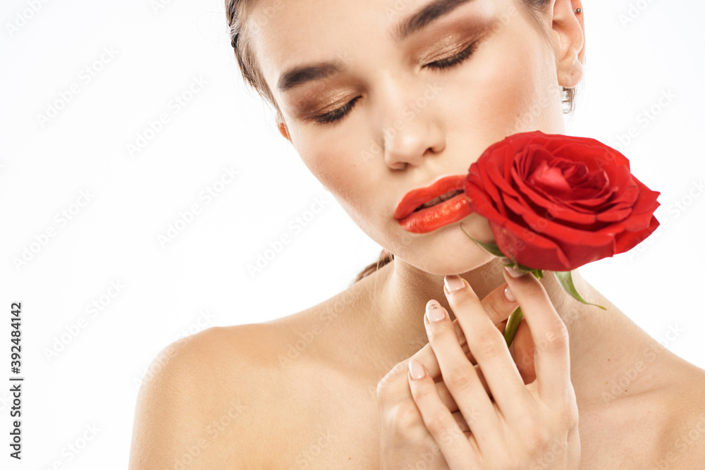 charming brunette girl with makeup on her face and a red rose in her hand charming brunette girl with makeup on her face and a red rose in her hand