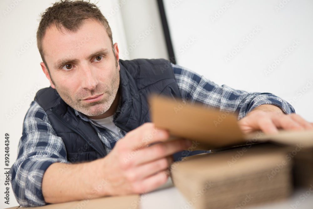 a man is sanding wood a man is sanding wood