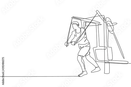One continuous line drawing of young sporty man working out with crossover cable machine in fitness gym club center. Healthy fitness sport concept. Dynamic single line draw design vector illustration