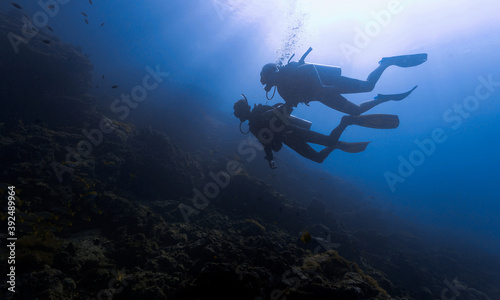 Scuba divers in sunlight        © Johan